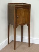 George III mahogany bedside potcupboard enclosed by single figure mahogany door on tapering legs,