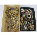 Trifari and other costume brooches in two boxes