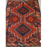 Persian Balochi red and blue ground rug,