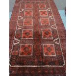 Persian Baluchi red ground rug,