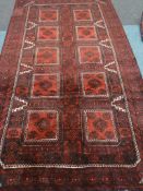 Persian Baluchi red ground rug,