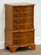 Sydney Smith reproduction yew wood chest on chest of small proportions fitted with six long drawers,