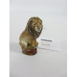 Halcyon Days porcelain lion with hallmarked silver-gilt base