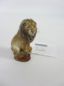 Halcyon Days porcelain lion with hallmarked silver-gilt base