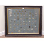 Complete set of cap badges (76) in large frame 90cm x 109cm overall