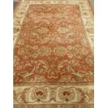 Chinese beige and peach ground rug,