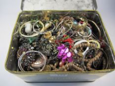 Large quantity costume jewellery oddments in old Milady toffee tin