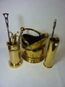 Brass coal helmet and shovel, brass shell case, tongs, poker etc