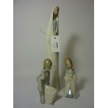 Lladro figure of a woman praying and two Lladro figures of children (3) H35cm