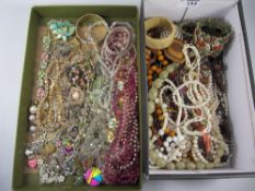 Vintage glass and other later beads and jewellery in two boxes