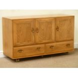 Ercol light elm three door sideboard fitted with two drawers to base, W130cm, H76cm,