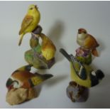 Four Royal Worcester bird sculptures 'Yellow Hammers', 'Nightingale',