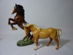Beswick rearing bay horse and a palomino horse (2)
