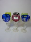Set of six cut crystal wine glasses with coloured bowls