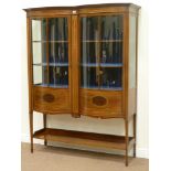 Edwardian mahogany double bow front display cabinet enclosed by two shaped glazed doors with