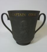 Large Royal Doulton black basalt limited edition twin handled cup commemorating Captain Cook and