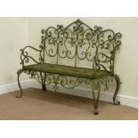 Ornate wrought metal garden bench,