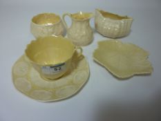 Belleek teacup and saucer, milk jug,