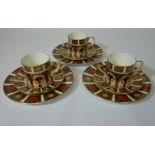 Three coffee cans with saucers and three side plates, pattern no. 1128 Condition Report Side