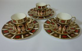 Three coffee cans with saucers and three side plates, pattern no. 1128 Condition Report Side