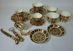 Large Royal Crown Derby tea cup and saucer, two coffee cans, four other cups, napkin ring,