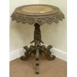 Early 20th century Burmese heavily carved rosewood tilt top table,