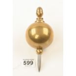 A heavy 7" bulbous brass plumb bob with