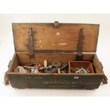 A pine ammunition box with spanners and