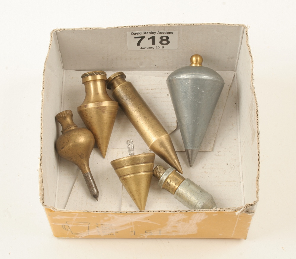 Four brass plumb bobs and two steel bobs