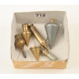 Four brass plumb bobs and two steel bobs