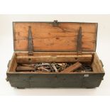 A pine ammunition box with spanners and