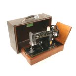 A SINGER sewing machine 240v in case wit