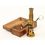 A lacquered brass drum microscope with S