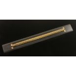 A 24" ebony and brass rolling parallel r