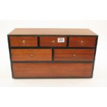 An unusual pine three drawer chest with lid over three dummy drawers with mahogany veneer to drawer