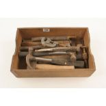 A box of cold chisels and hammers