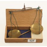 A balance with brass pans with weights in oak box G+