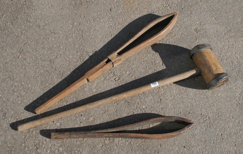 A mallet and two saddler's cramps