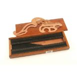 A three piece Marquois set by YEATS Dublin in black plastic in mahogany box G++