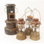 Three 'Tilley' lamps and a workshop heater