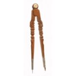 A magnificent pair of early European cherrywood dividers with superbly carved 15" legs with shell