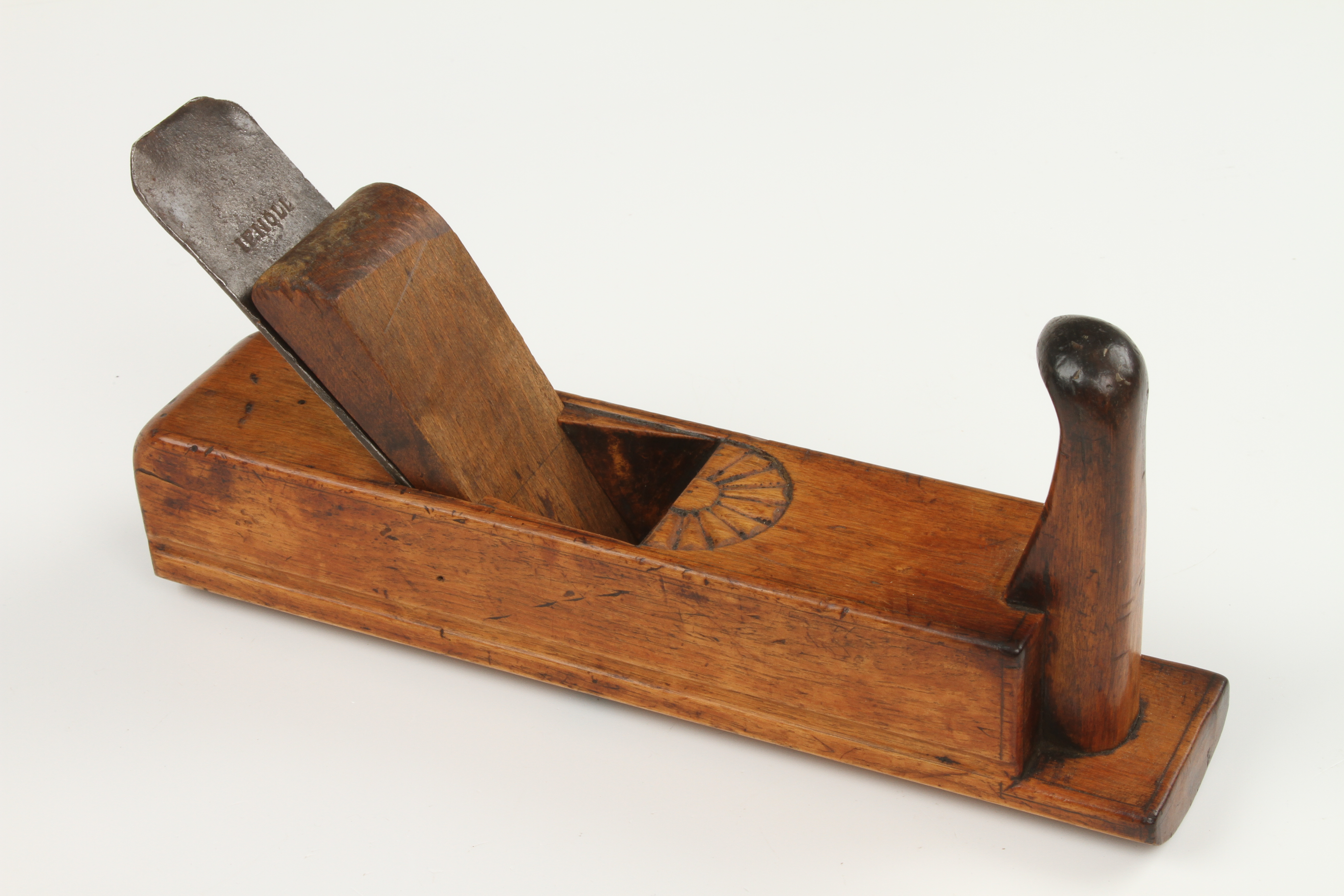 A European birch gutter plane with carved decoration at escapement,