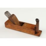 A European birch gutter plane with carved decoration at escapement,