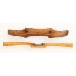 A slender boxwood spokeshave with Made for W Marshall Manchester and another with rams horn grips