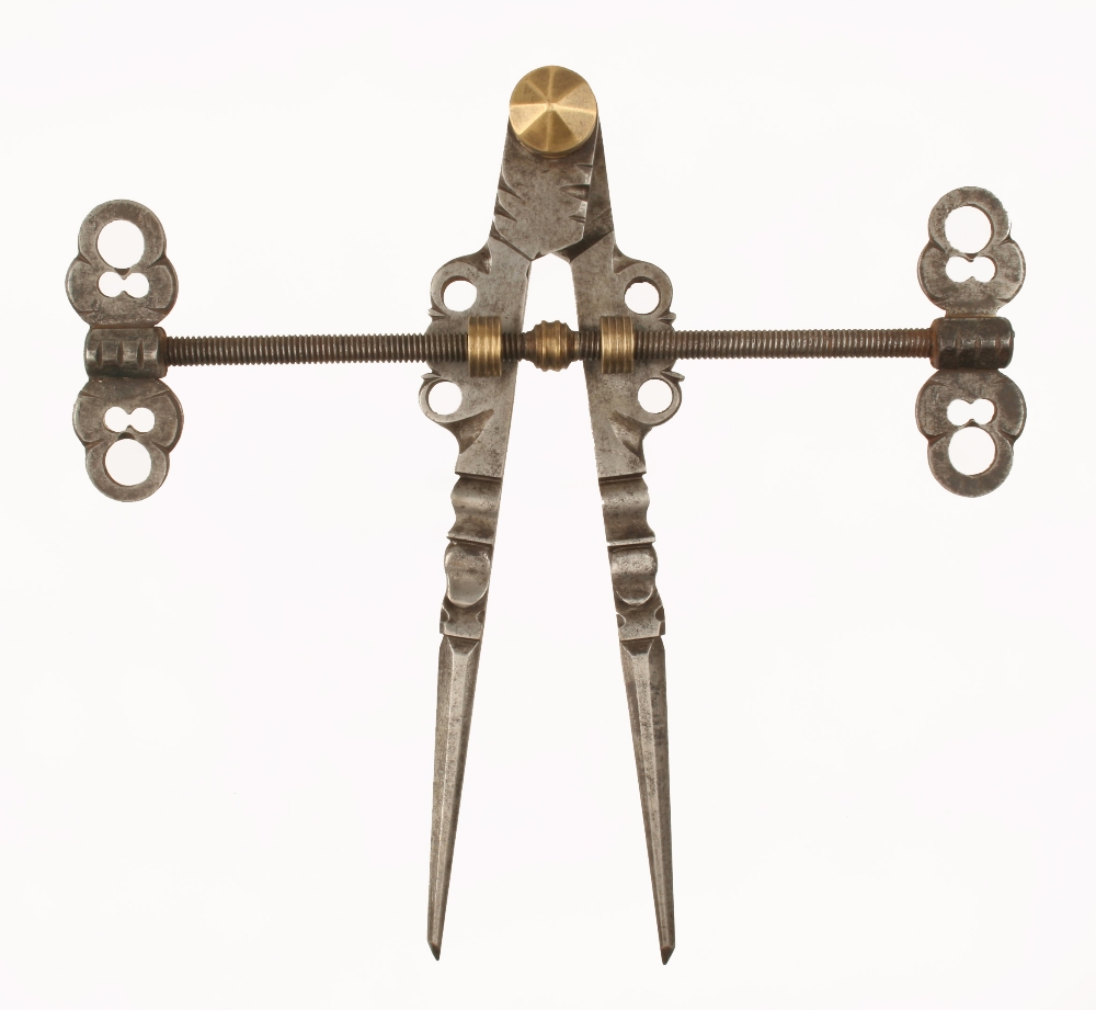 A superb early pair of 17/18c German armourers compasses with faceted and moulded 9" legs,