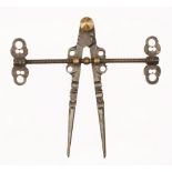 A superb early pair of 17/18c German armourers compasses with faceted and moulded 9" legs,