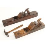 A trying plane and jack plane and an early farriers hammer all showing the hand indentations