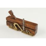 A 19c French fruitwood moving fillister with fancy brass depth stop and fence,