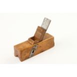 A small boxwood sliding box type chamfer plane 6" x 2" with replaced wedge (illustrated Russell fig