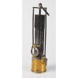 An rare early 19th century Davy lamp with a cage of four steel bars protecting the gauze,  the front